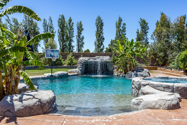 Custom pool in the San Antonio, Hill Country area with family-friendly features for a blog post from Lotus Pools and Landscapes.